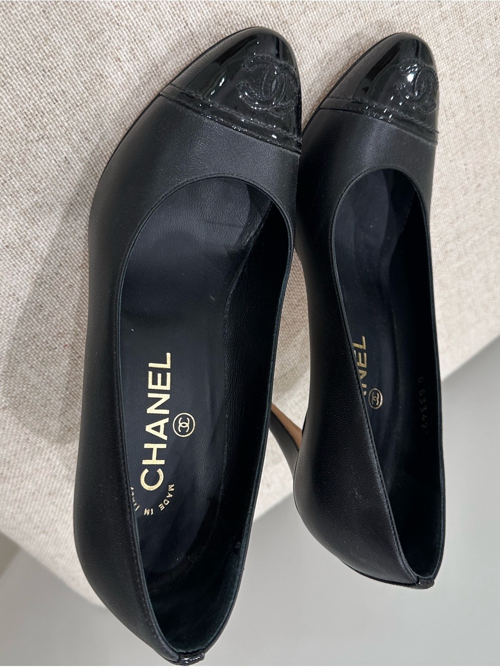 CHANEL Black Leather Pumps with Patent Cap-Toe